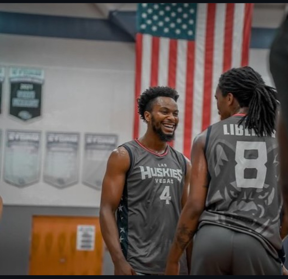 Las Vegas Huskies players smiling during a game