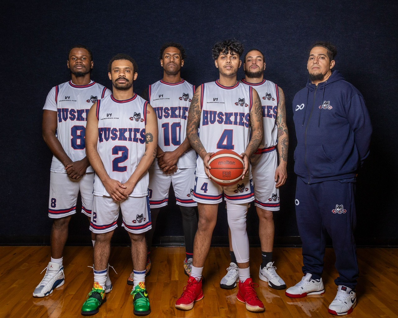 Vancouver Huskies players and coach posed in uniform